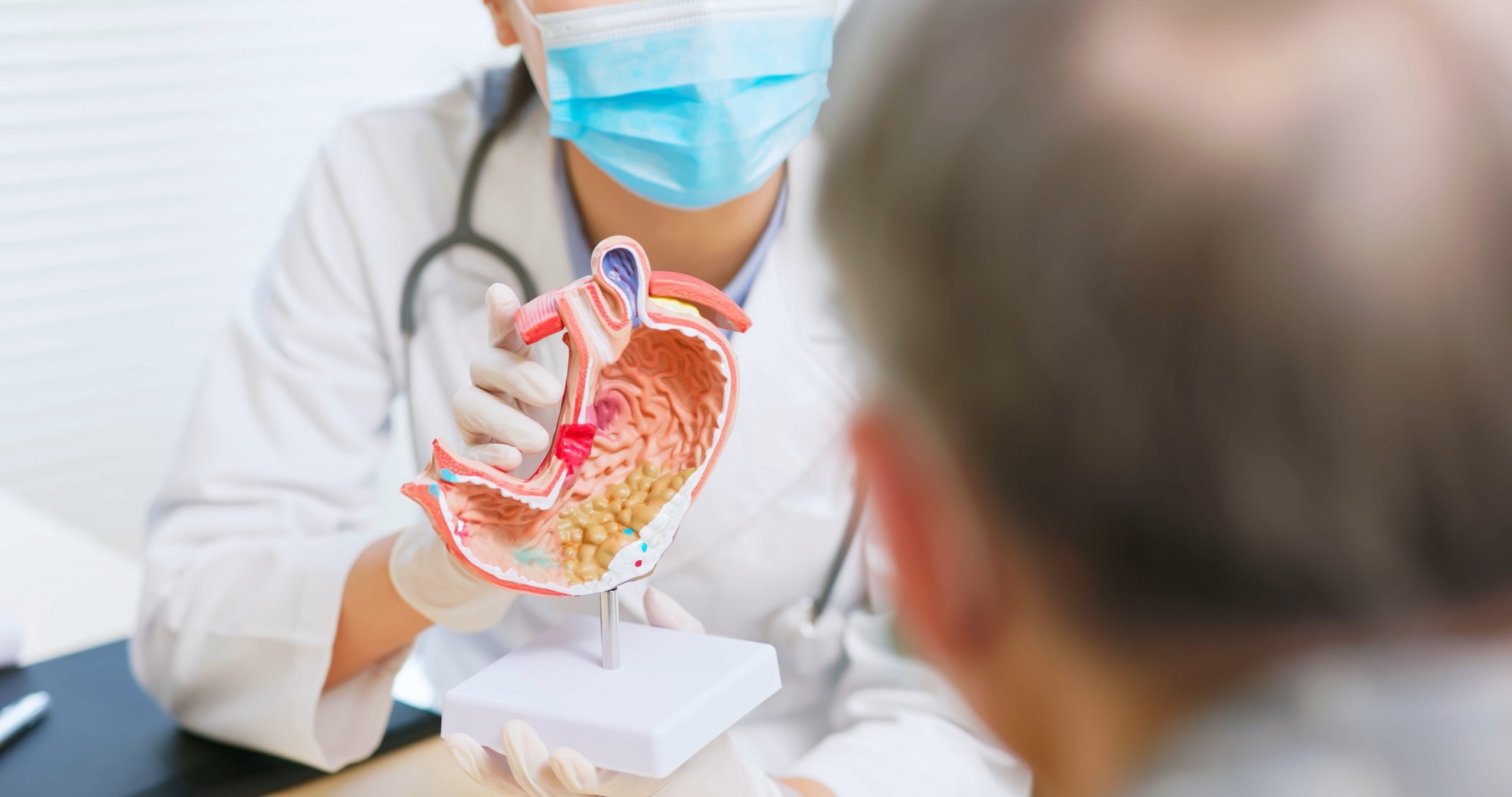 Close,Up,Of,Asian,Female,Doctor,Wearing,Face,Mask,Is